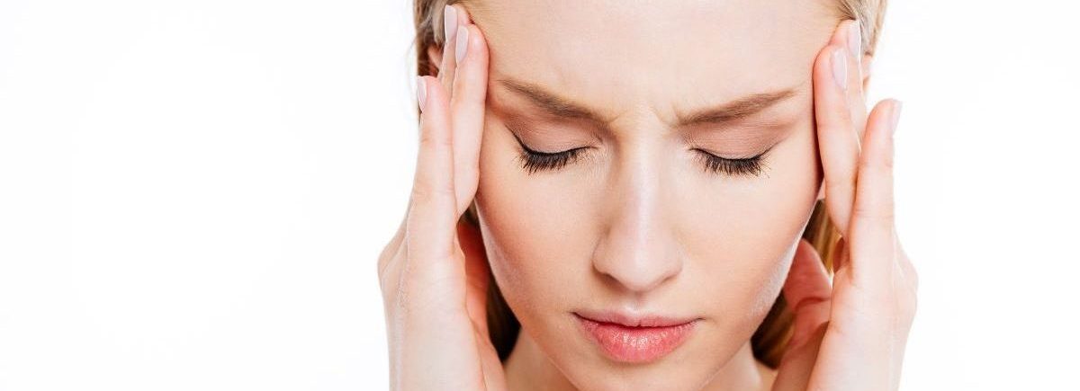 ból głowy przed okresem